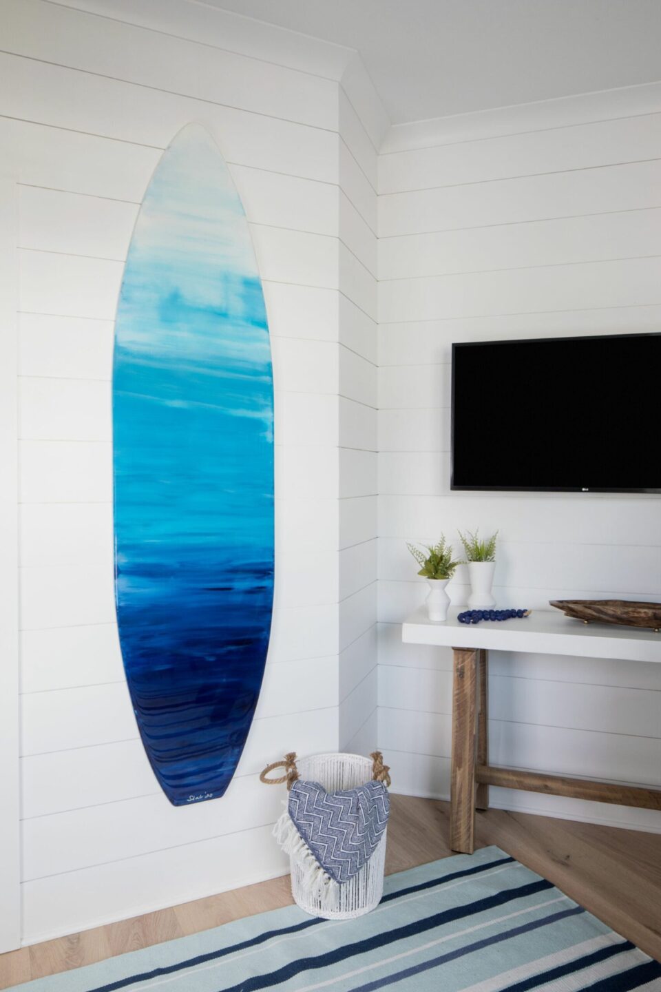 Blue And White Surfboard Hanging On Bedroom Wall