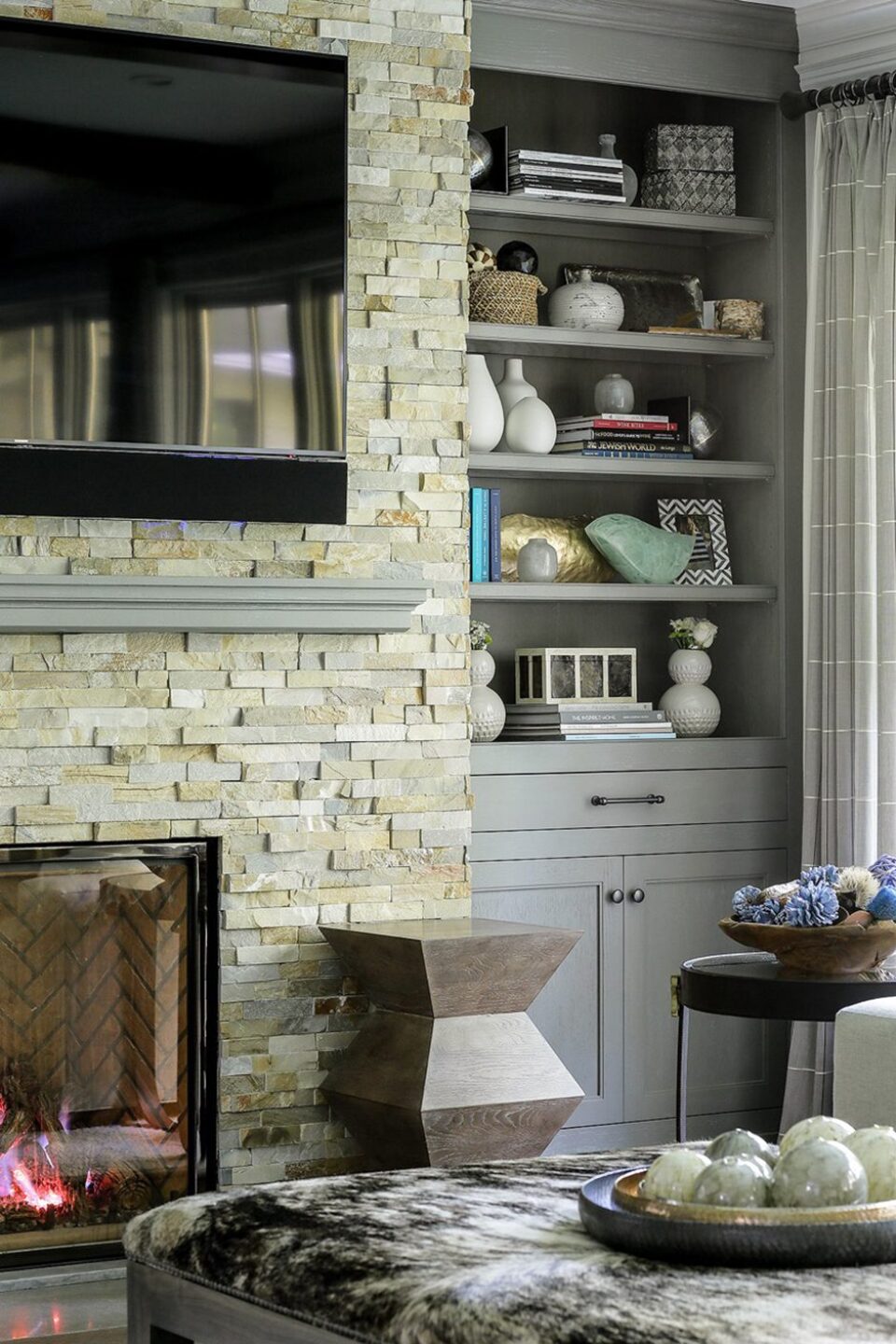 Built In Shelves Around Stone Fireplace