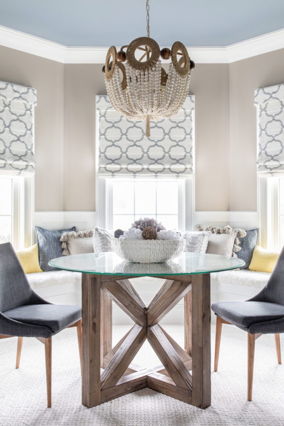 Glass Top Round Table With Dark Gray Chairs