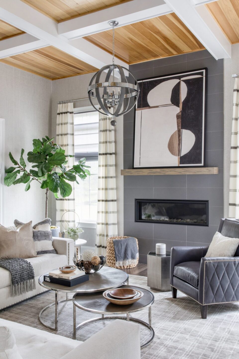 Living Room Fireplace With Wood Mantel And Artwork