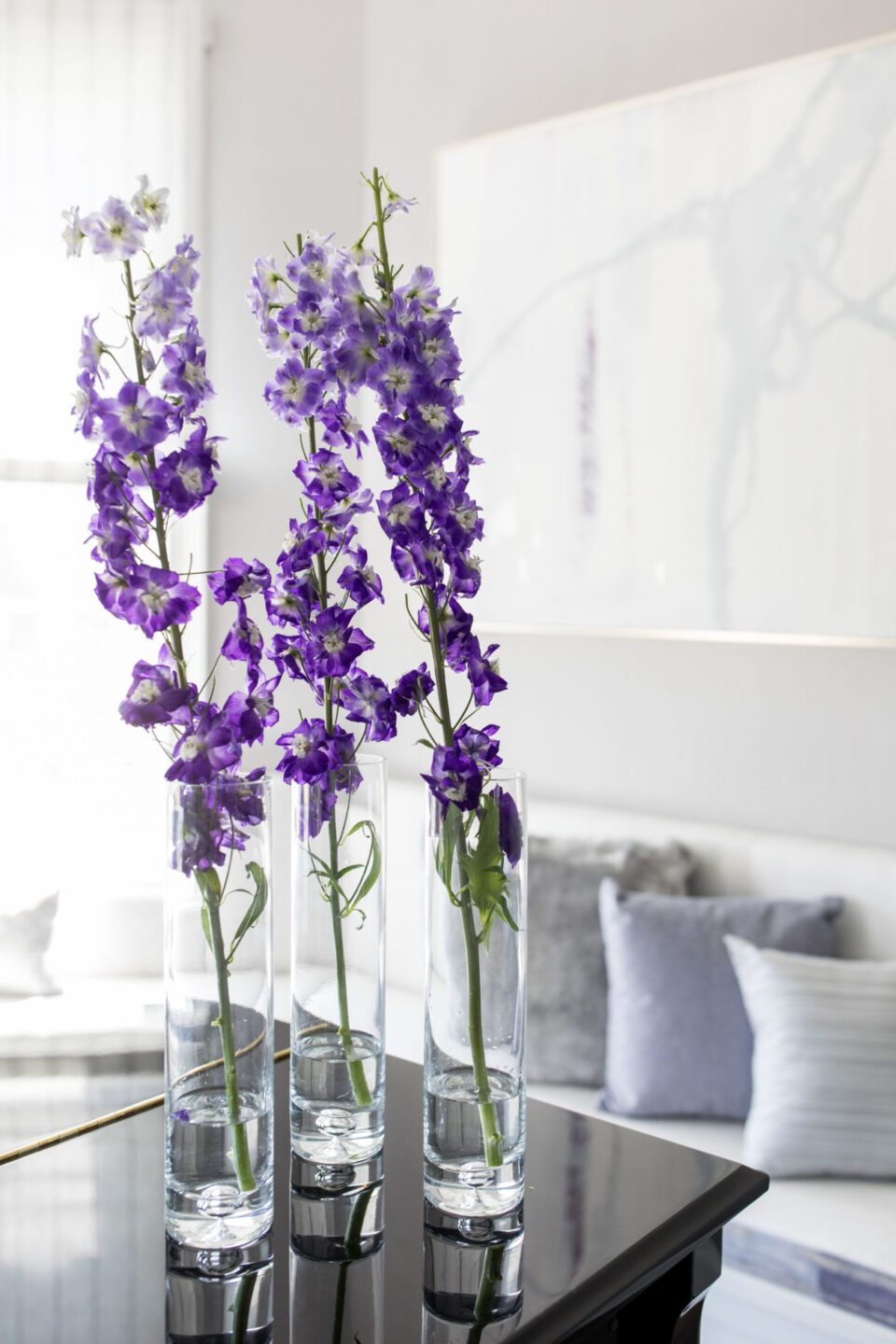 Purple Flowers In Vases On Piano