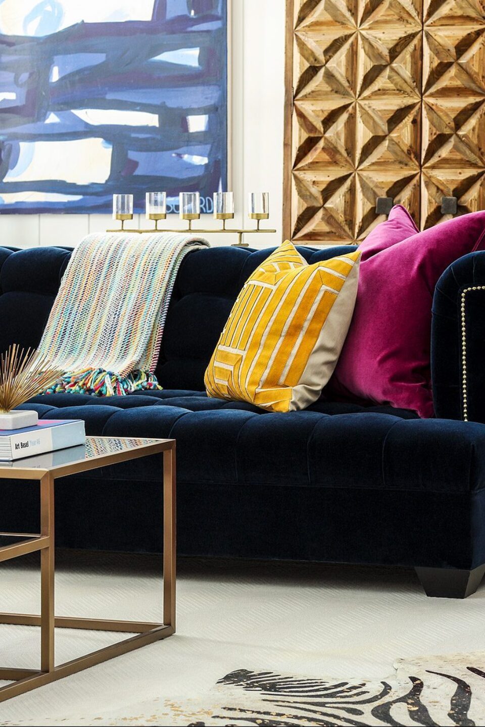 Yellow And Pink Accent Pillows On Blue Sofa